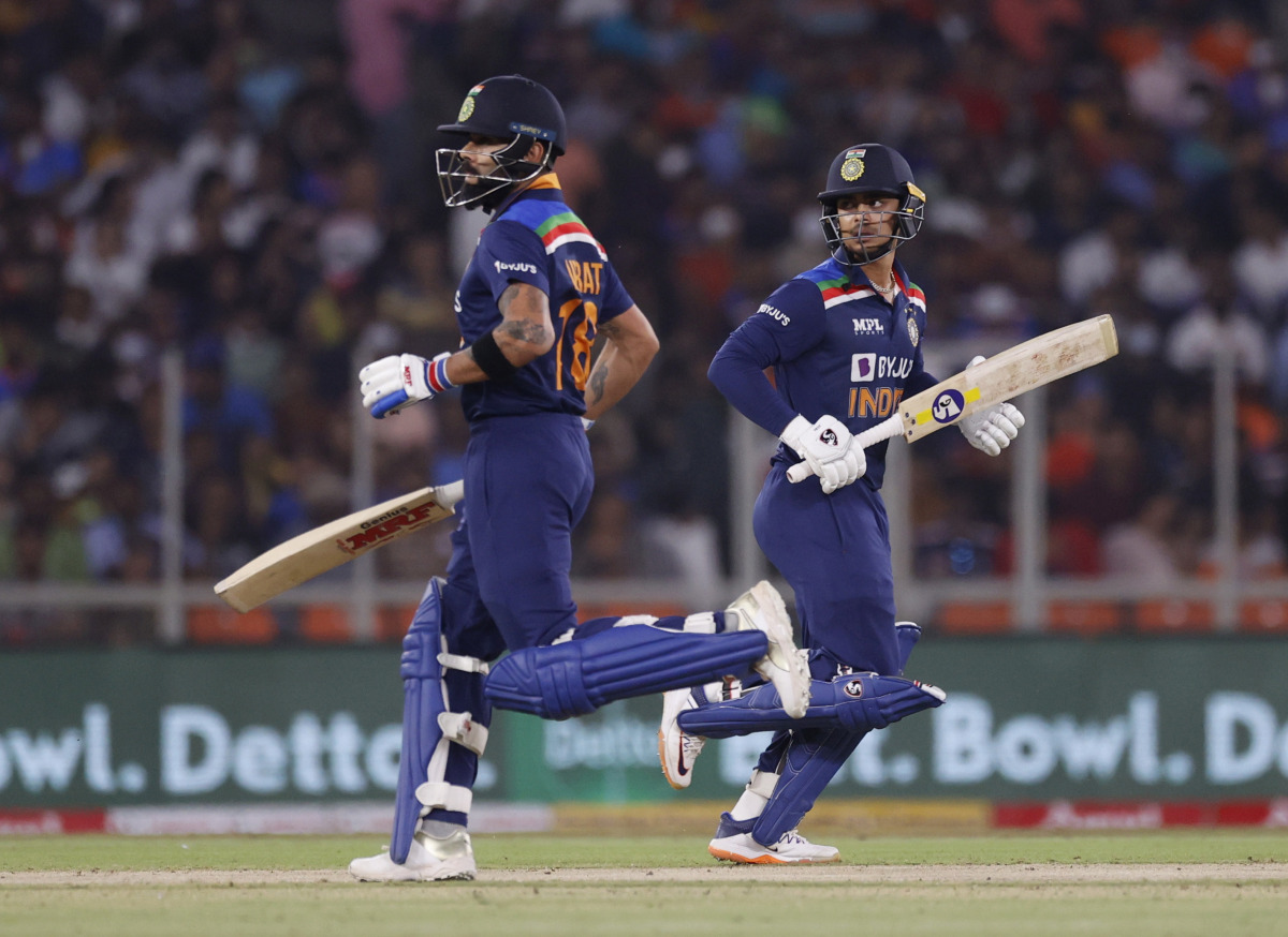 Cricket - Second Twenty20 International - India v England - Narendra Modi Stadium, Ahmedabad, India - March 14, 2021 India's Virat Kohliand Ishan Kishan in action REUTERS/Danish Siddiqui
