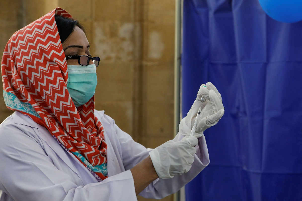 FILE PHOTO: A paramedic prepares a dose of Sinopharm's coronavirus disease (COVID-19) vaccine before administering it to a health worker at... AKHTAR SOOMRO March 18, 2021
