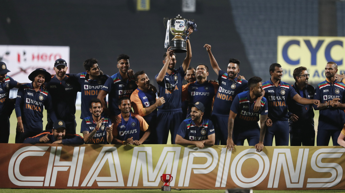 Cricket - Third One Day International - India v England - Maharashtra Cricket Association Stadium, Pune, India - March 28, 2021 India celebrate winning the series with the trophy REUTERS/Francis Mascarenhas
