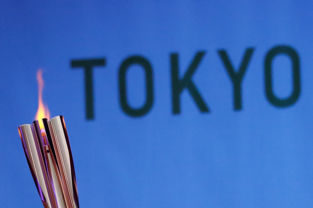 The Olympic torch is seen at Hibarigahara Festival Site, during the last leg of the first day of the Tokyo 2020 Olympic torch relay, in Minamisoma, Fukushima prefecture, Japan, March 25, 2021. REUTERS/Issei Kato/File Photo