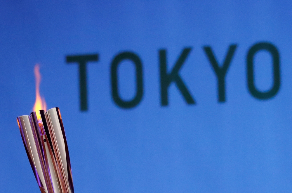 The Olympic torch is seen at Hibarigahara Festival Site, during the last leg of the first day of the Tokyo 2020 Olympic torch relay, in Minamisoma, Fukushima prefecture, Japan, March 25, 2021. REUTERS/Issei Kato/File Photo/File Photo