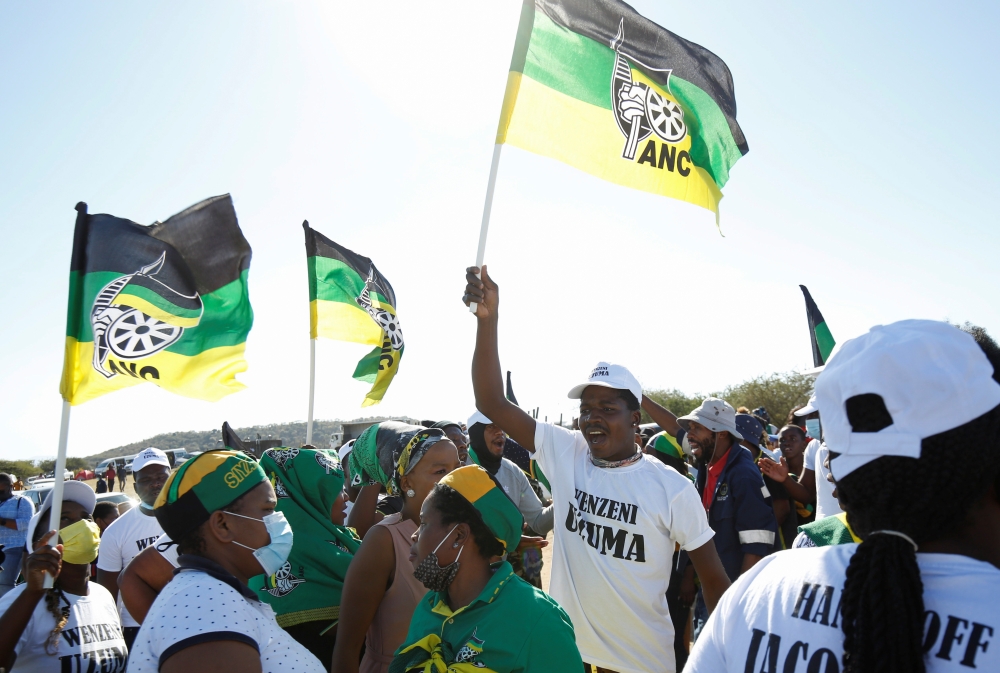 Supporters of former South African President Jacob Zuma, who was sentenced to a 15-month imprisonment by the Constitutional Court, sing and dance in front of his home in Nkandla, South Africa, July 3, 2021. (Reuters/Rogan Ward)