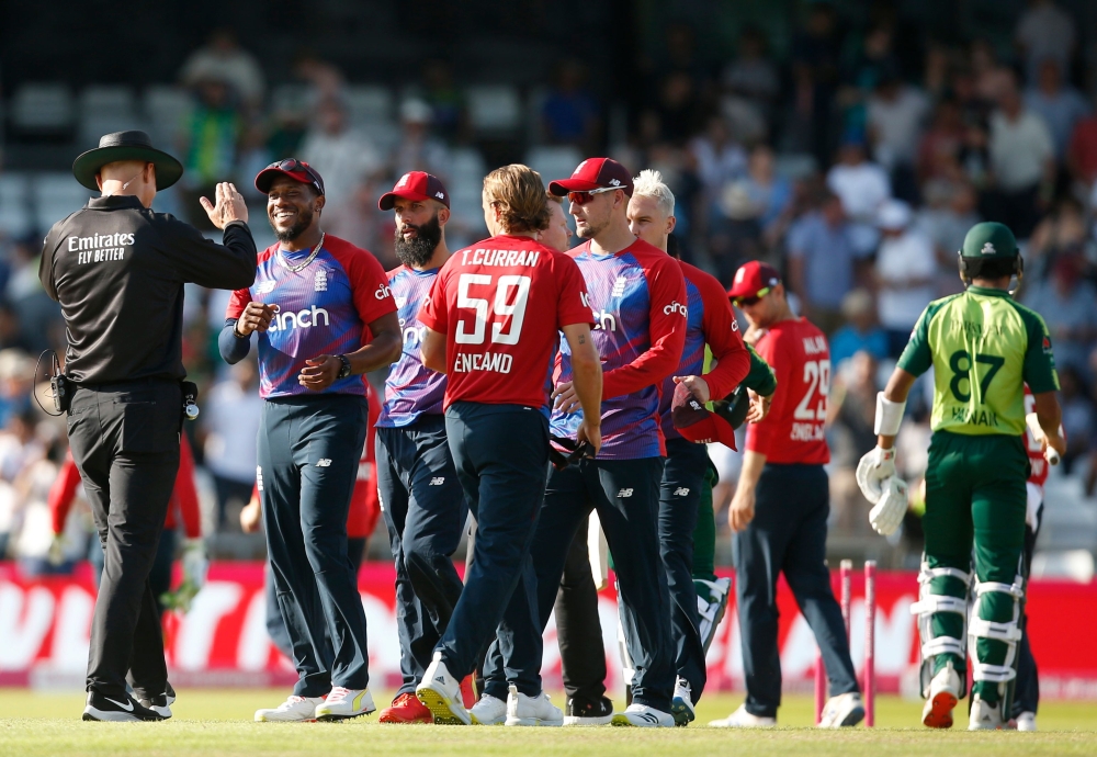cricket - Second Twenty20 International - England v Pakistan - Headingley, Leeds, Britain - July 18, 2021 England's Tom Curran and teammates celebrate after the match Action Images via Reuters/Ed Sykes
