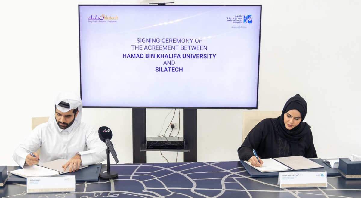 Silatech CEO, Hassan Ali Al Mulla and Dr. Maryam H Al Mannai, Vice-President for Student Affairs at HBKU, signing the agreement.