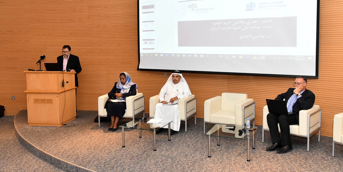 Prof. Noureddine Miladi, (left) Mass Communication Department at QU during a presentation in the presence of (right) Dr. Moez ben Messaoud (right) and others. 