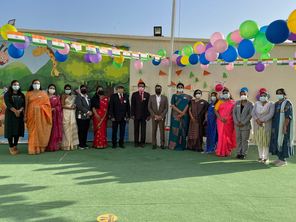 The management members, senior leadership team, and teachers of Olive International School after hoisting  the national flag.