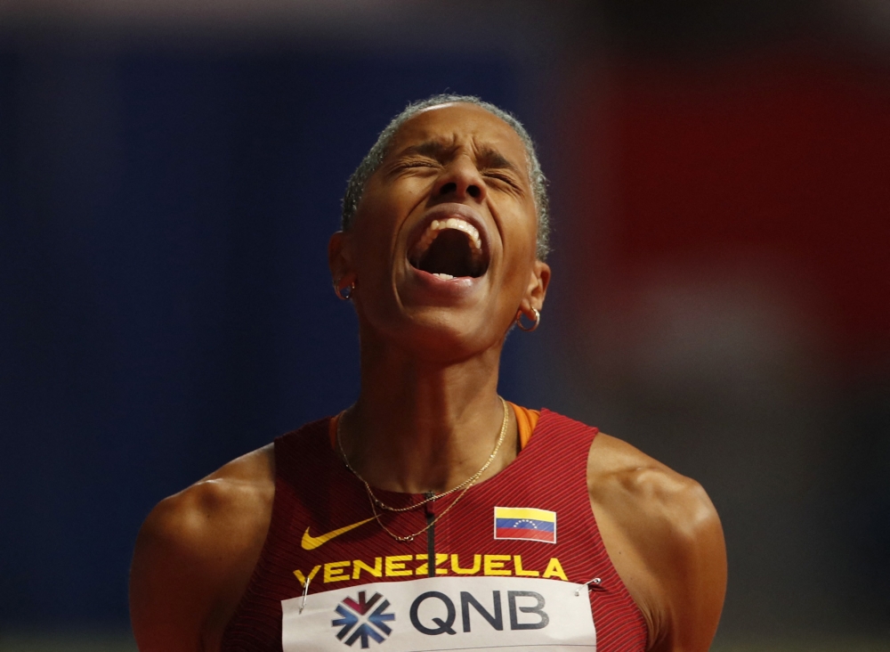 March 20, 2022 Venezuela's Yulimar Rojas celebrate winning goal and setting a new world record in the women's triple jump final REUTERS/Bernadett Szabo