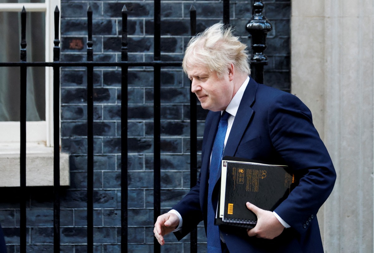 FILE PHOTO: British Prime Minister Boris Johnson leaves Downing Street, in London, Britain, February 24, 2022. REUTERS/Peter Cziborra/File Photo
