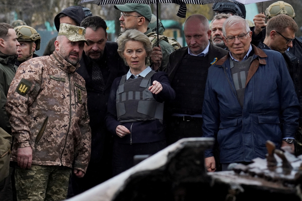 European Commission President Ursula von der Leyen, High Representative of the European Union for Foreign Affairs and Security Policy Josep Borrell and Ukraine's Prime Minister Denys Shmyhal visit the town of Bucha, as Russia's attack on Ukraine continues, outside of Kyiv, Ukraine April 8, 2022. REUTERS/Janis Laizains