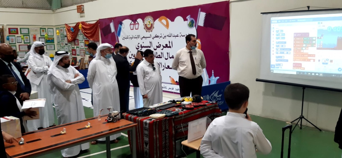 Officials at an exhibition showcasing achievements of the students.