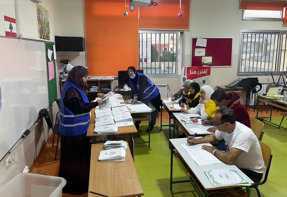 Electoral workers count ballots after the polls were closed during Lebanon's parliamentary election in Khiam, in southern Lebanon May 15, 2022. Reuters/Issam Abdallah