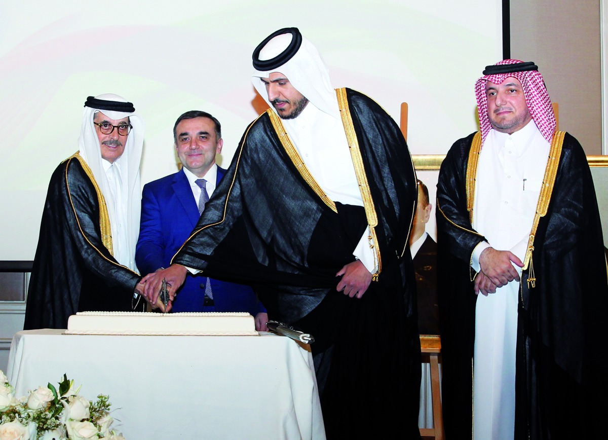 From left: Minister of State and President of Qatar National Library H E Dr. Hamad bin Abdulaziz Al Kuwari; Ambassador of Azerbaijan to Qatar Rashad Ismayilov and Minister of Commerce and Industry H E Sheikh Mohammed bin Hamad bin Qassim Al Abdullah Al Thani, jointly cutting a cake to mark the National Day of Azerbaijan at the JW Marriott Marquis City Centre Hotel on Thursday. Director of Protocol Department at the Ministry of Foreign Affairs, Ambassador H E Ibrahim Yousif Fakhroo (right), and diplomats from various countries were also present.  Pic: Salim Matramkot/The Peninsula