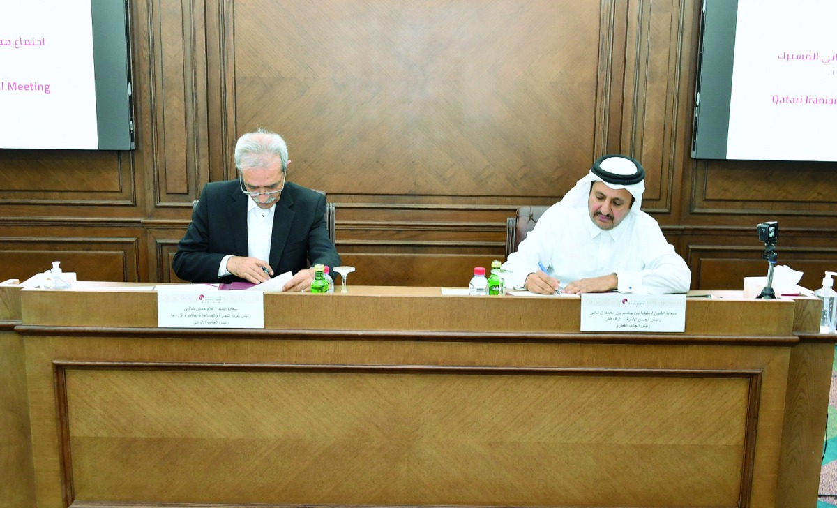 QC Chairman Sheikh Khalifa bin Jassim Al Thani and President of the ICCIMA Gholam Hossein Shafei during the agreement signing.