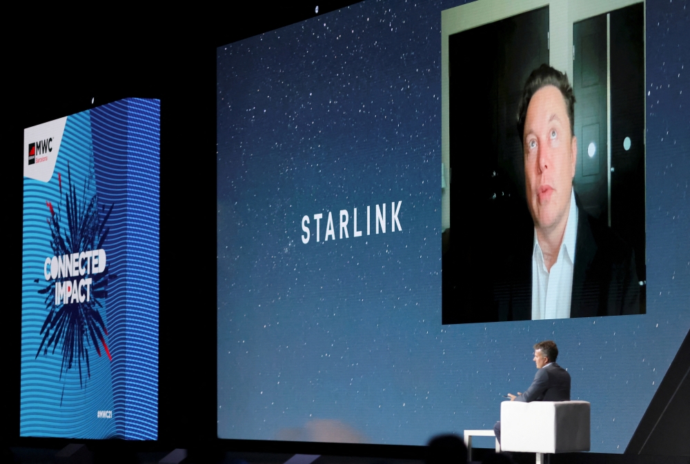 FILE PHOTO: SpaceX founder and Tesla CEO Elon Musk speaks on a screen during the Mobile World Congress (MWC) in Barcelona, Spain, June 29, 2021. REUTERS/Nacho Doce/File Photo