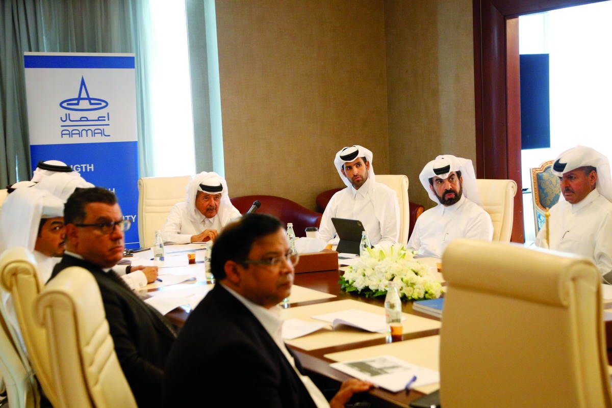 Aamal’s Chairman Sheikh Faisal bin Qassim Al Thani, and CEO Rashid bin Ali Al Mansoori, with other officials, during the meeting in Doha, recently. 