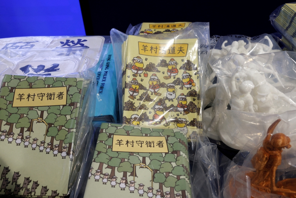 Children's books are pictured during a news conference after five people were arrested on suspicion of conspiring to publish 