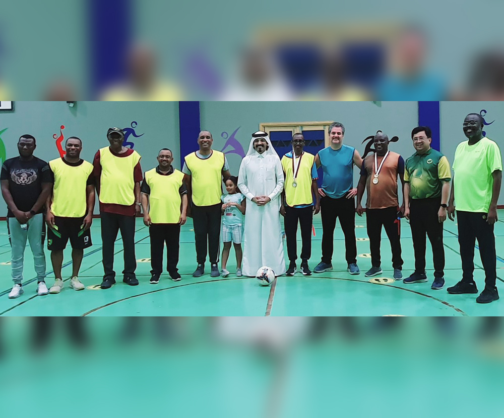 Participants pose for a photo during the walking football meet.