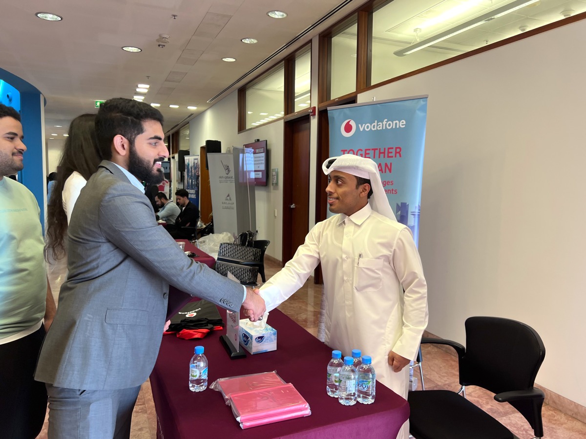 A Vodafone Qatar official interacting with students from Texas A&M University at Qatar’s ‘Career Cafe’ event, in Doha, recently. 