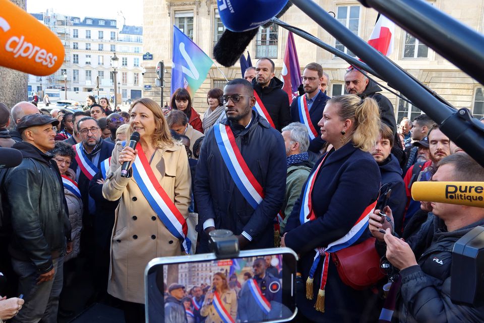 Member of parliament Carlos Martens Bilongo, of the French far-left opposition party La France Insoumise (France Unbowed) and the left-wing coalition NUPES, MP Sandra Regol and Mathilde Panot, MP and President of the French far-left opposition party La France Insoumise (LFI) parliamentary group, attend a demonstration in front of the National Assembly, the day after a far-right MP shouted 