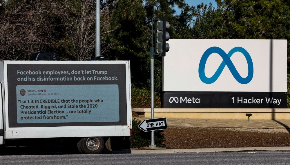 In this file photo taken on January 17, 2023, a mobile billboard, deployed by Accountable Tech, is seen outside the Meta Headquarter in Menlo Park, California. (Photo by Kimberly White / Getty Images NA / AFP)