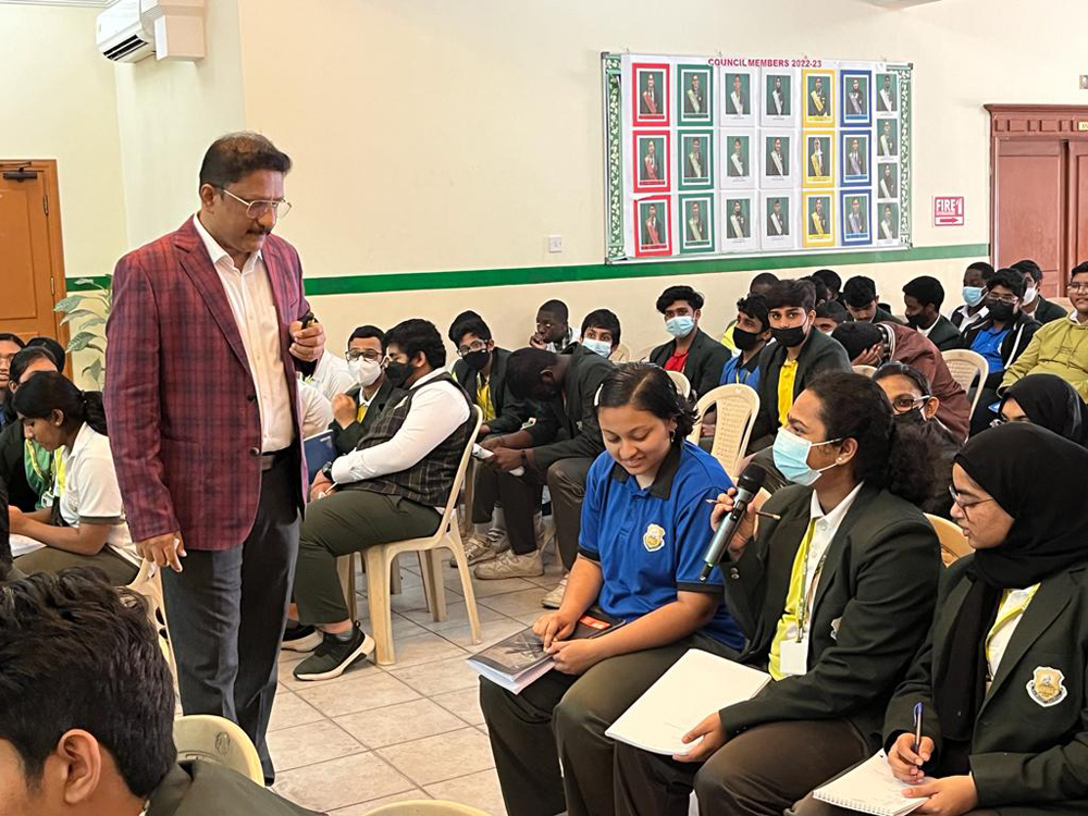 Dr. Rajeev Thomas interacting with students during a session at Olive International School.