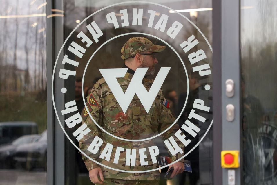 A man wearing a camouflage uniform walks out of PMC Wagner Centre, which is a project implemented by the businessman and founder of the Wagner private military group Yevgeny Prigozhin, during the official opening of the office block in Saint Petersburg, Russia, November 4, 2022. (REUTERS/Igor Russak)