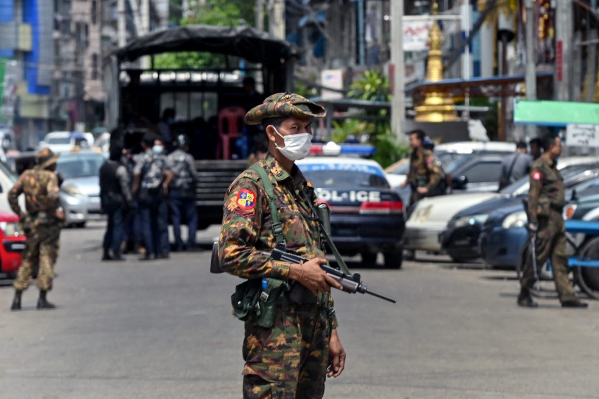 A soldier stands guard along a road as security forces search for protesters in Yangon on May 7, 2021. File photo / AFP

