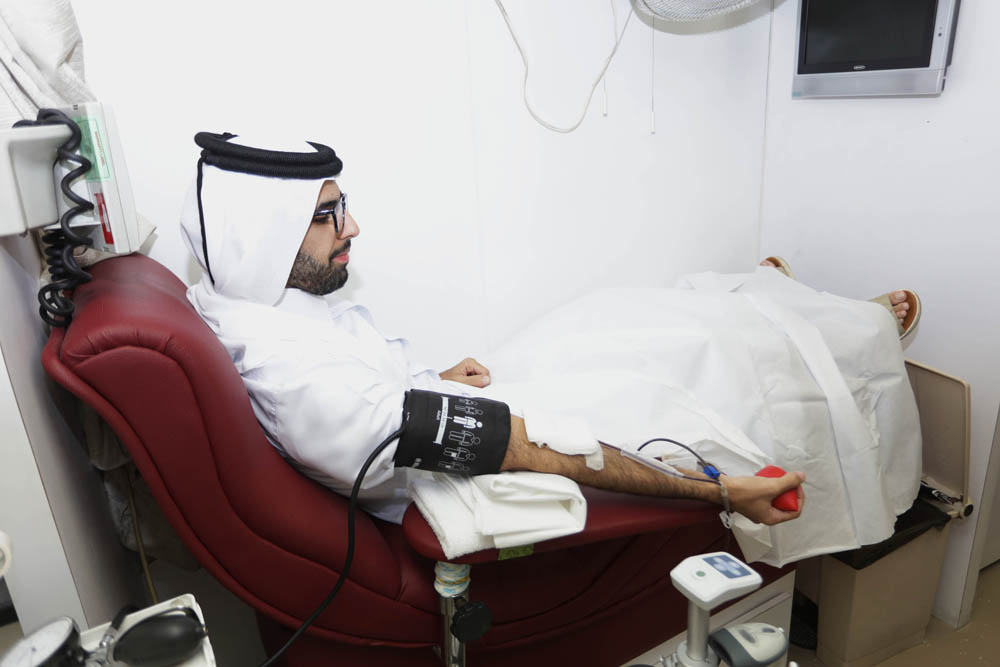 A QLM personnel donating blood during the campaign.