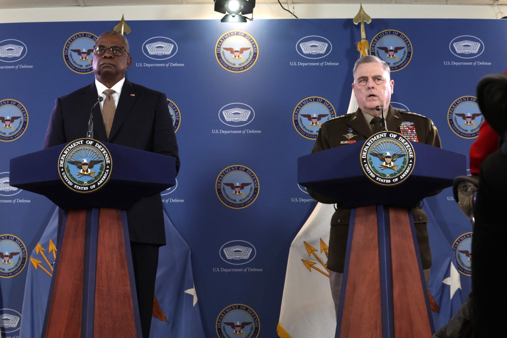 US Secretary of Defense Lloyd Austin (L) listens as Chairman of the Joint Chiefs of Staff Army Gen. Mark Milley speaks during a press conference at the Pentagon on March 15, 2023 in Arlington, Virginia. Alex Wong/Getty Images/AFP 