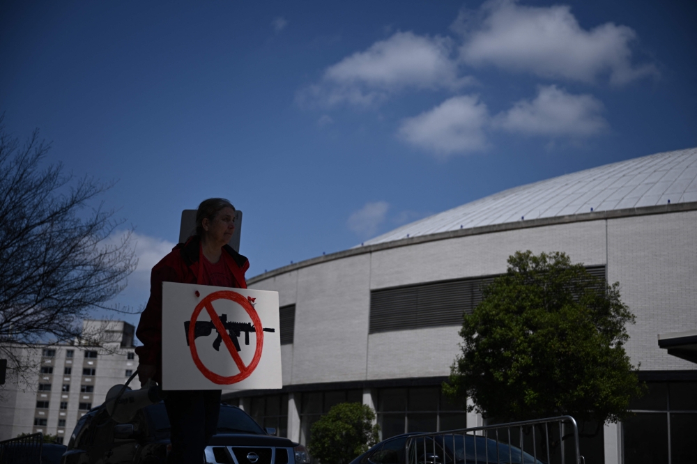 Gun control activists rally in Nashville, Tennessee on March 28, 2023, following a school shooting, where three students and three staff members were killed on March 27. (Photo by Brendan SMIALOWSKI / AFP)
