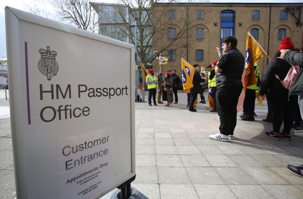 Members of the Public and Commercial Services (PCS) union stand on a picket line on the first day of a five-week strike by UK passport office workers, in London on April 3, 2023. Photo by Susannah Ireland / AFP