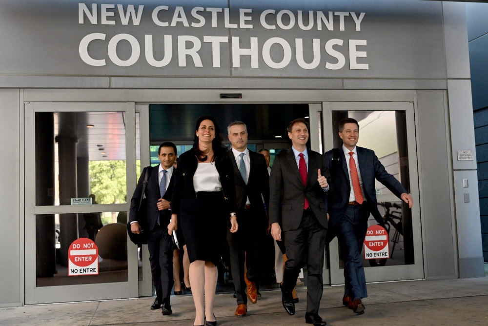 Justin Nelson (2R), joined by fellow members of the Dominion Voting Systems legal team, depart the Leonard Williams Justice Center in Wilmington, Delaware, on April 18, 2023. - Vote machine maker Dominion and Fox News settled a defamation case over falsehoods about the 2020 presidential election aired on the conservative TV network, a US judge announced Tuesday. (Photo by ANDREW CABALLERO-REYNOLDS / AFP)