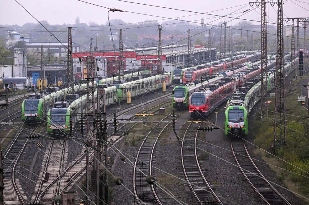 Parked commuter trains are seen during a strike of rail workers at the main railway station of Essen, western Germany, on April 21, 2023. Photo by Ina FASSBENDER / AFP