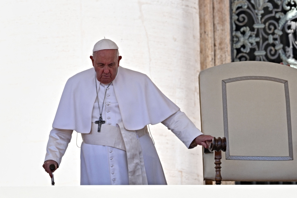 :Pope Francis arrives for his audience to participants in the pilgrimage of thanksgiving for the beatification of Armida Barelli, at St. Peter Square in the Vatican on April 22, 2023. (Photo by Andreas SOLARO / AFP)
