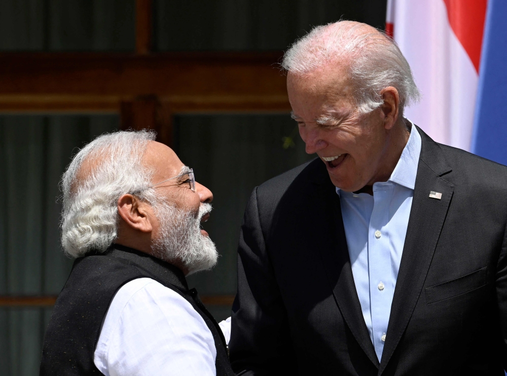In this June 27, 2022 file photo, US President Joe Biden greets India's Prime Minister Narendra Modi as they arrive to attend the outreach program on at Elmau Castle, southern Germany, during the Group of Seven Summit. (Photo by Tobias Schwarz / AFP)