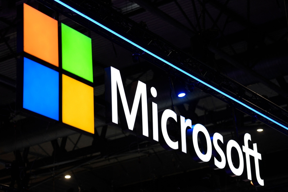 A Microsoft logo is displayed at the MWC (Mobile World Congress) in Barcelona on March 2, 2022. Photo by Josep LAGO / AFP