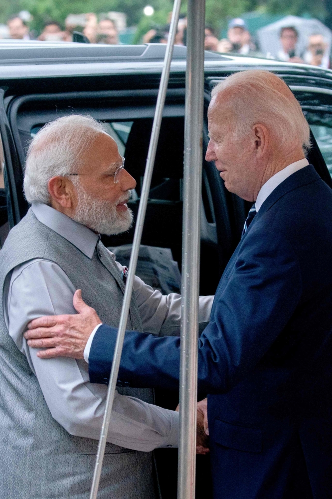 US President Joe Biden (R) greets India's Prime Minister Narendra Modi as he arrives at the South Portico of the White House in Washington, DC on June 21, 2023.
Photo by Stefani Reynolds / AFP