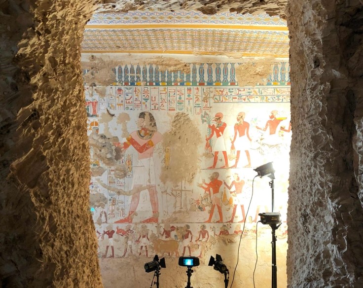 This handout photograph released by the CEA ULiege on July 12, 2023 shows studio lights illuminating a mural of the tomb of Menna, in Sheikh Abd el Qurnah, near Luxor in Egypt, on January 8, 2018. (Photo by Handout / CEA ULIEGE / AFP)