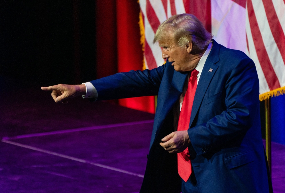 Former US President and 2024 hopeful Donald Trump points to the crowd after speaking during the Alabama Republican Party's summer dinner in Montgomery, Alabama, on August 4, 2023. (Photo by Elijah Nouvelage / AFP)
