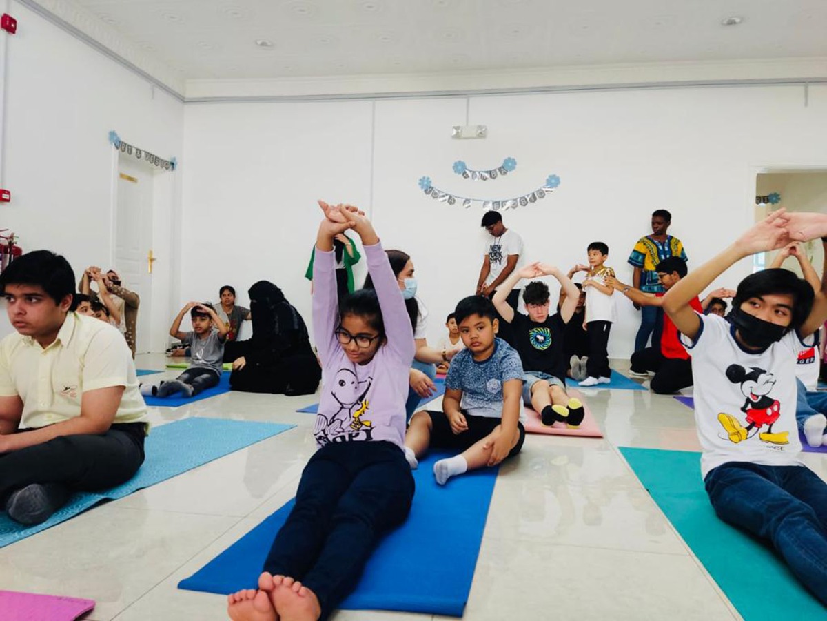Participants during a yoga session at the summer camp.