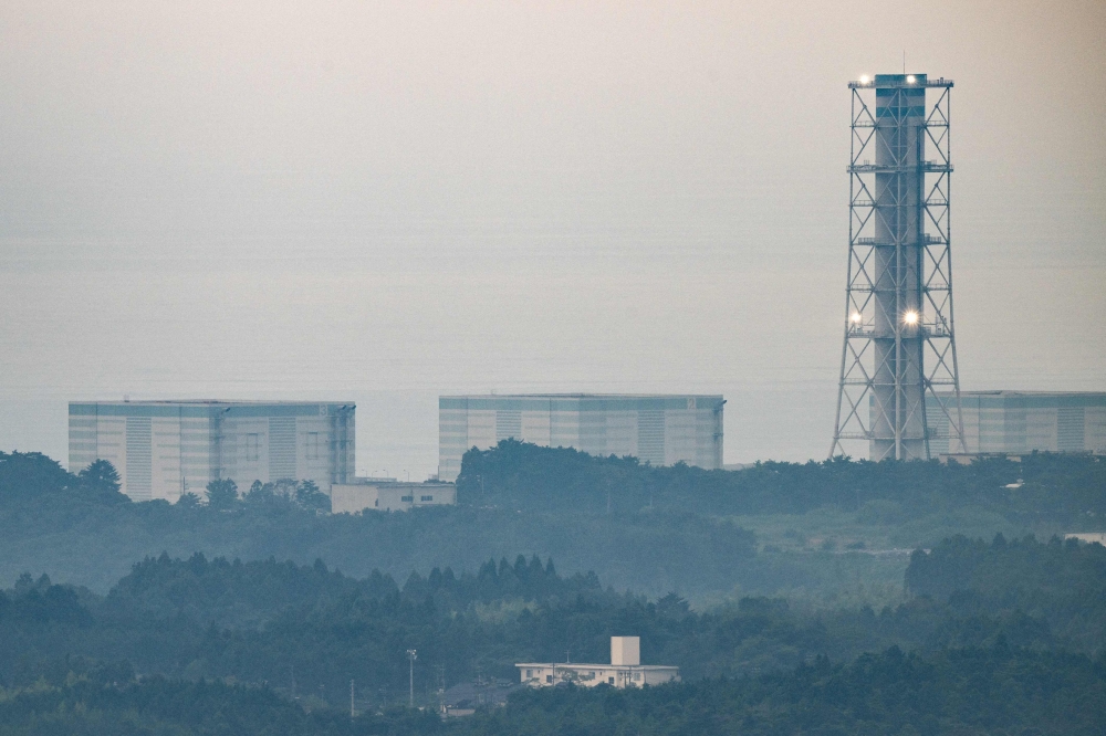 A general view shows a section of the Tokyo Electric Power Company Holdings (TEPCO) Fukushima Daiichi nuclear power plant from a hilltop in Tomioka town about 12km away from the facility in Fukushima Prefecture, on August 20, 2023. Photo by Philip FONG / AFP