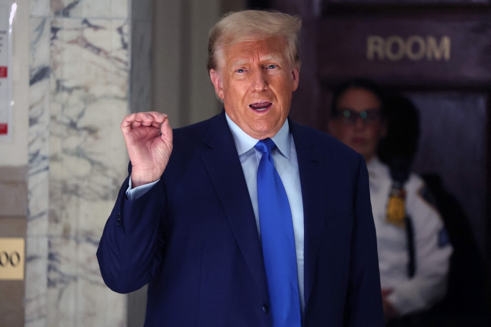 Former President Donald Trump speaks to the media during a break in his civil fraud trial at New York State Supreme Court on October 24, 2023 in New York City. (Photo by Spencer Platt/Getty Images/AFP)