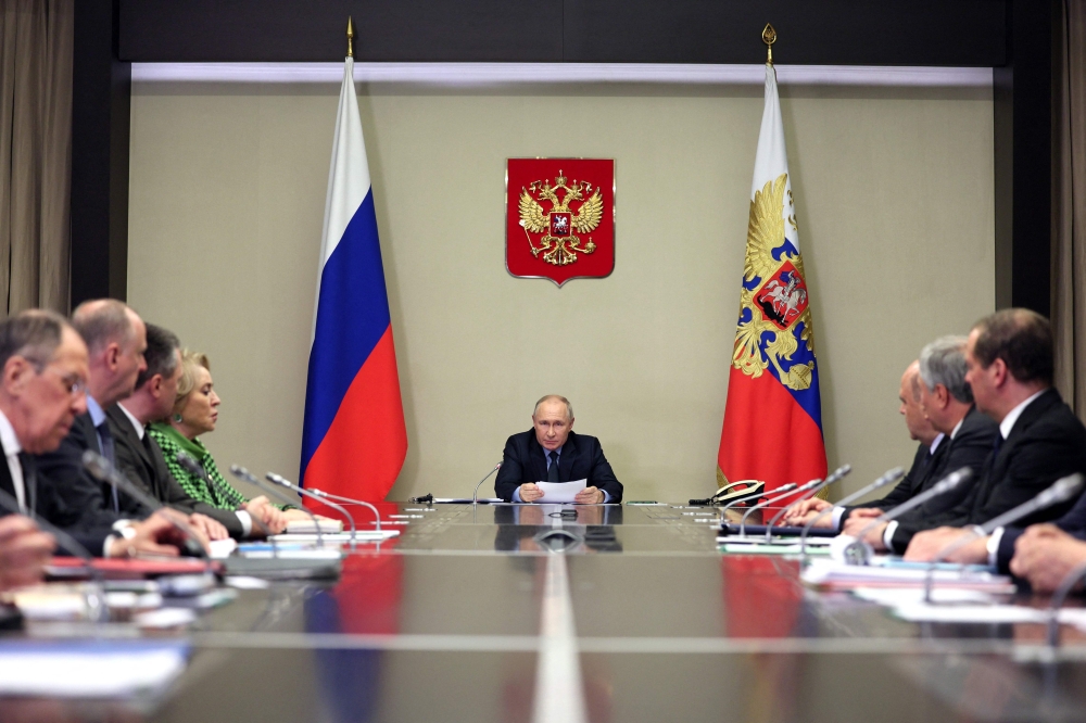 In this pool photograph distributed by Sputnik agency Russia's President Vladimir Putin (centre) chairs a meeting with members of Security Council, Russian government and law enforcement agencies in Moscow on October 30, 2023. (Photo by Gavriil Grigorov / POOL / AFP)