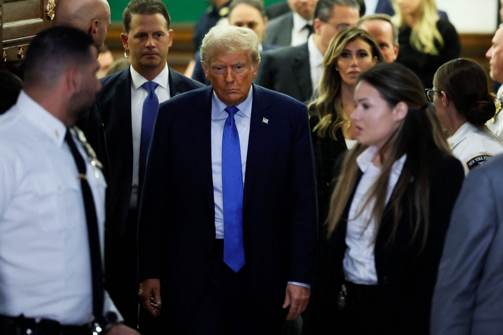 Former President Donald Trump exits the courtroom after testifying at his civil fraud trial at New York State Supreme Court on November 06, 2023 in New York City. Michael M. Santiago/Getty Images/AFP