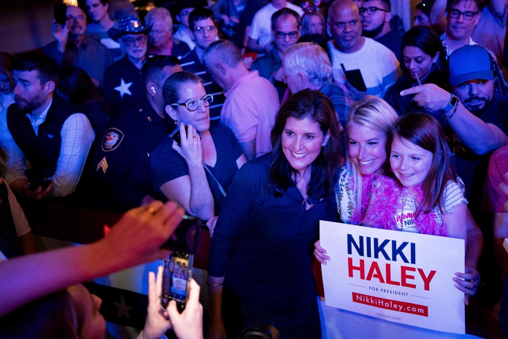Republican presidential candidate, former UN Ambassador Nikki Haley poses for pictures with her supporters following a campaign rally on March 4, 2024 in Fort Worth, Texas. Emil Lippe/Getty Images/AFP 