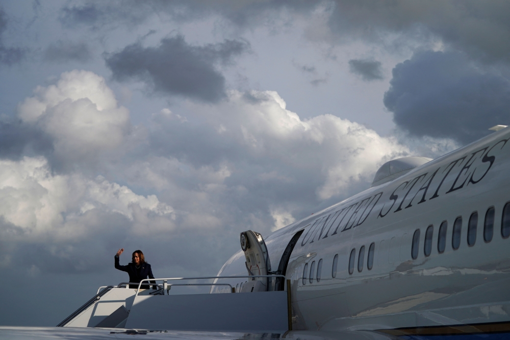 US Vice President Kamala Harris waves as she boards Air Force Two at Fort Lauderdale-Hollywood International Airport in Fort Lauderdale, Florida, on March 23, 2024. (Photo by Drew ANGERER / AFP)

