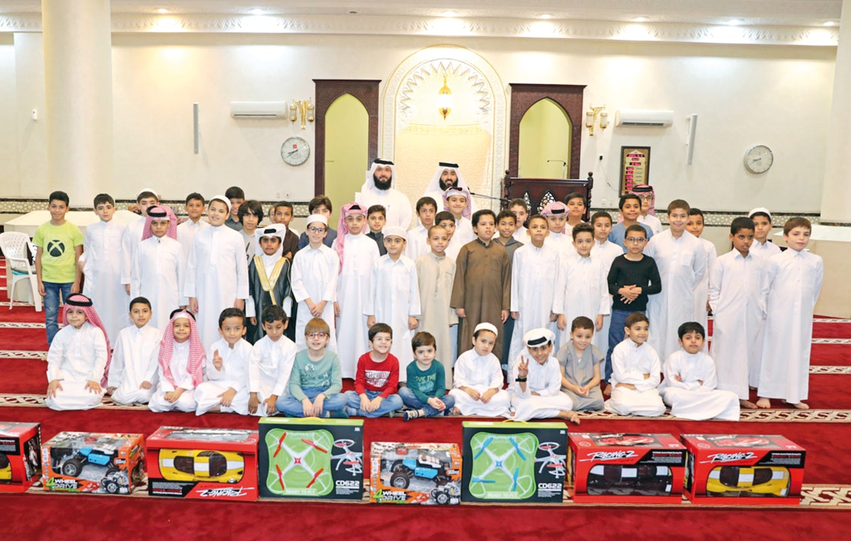 Contest winners with officials of the Ministry of Awqaf during the prize presentation.