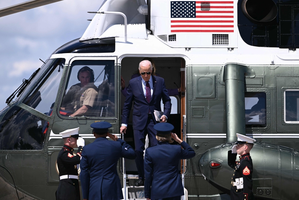US President Joe Biden arrives to board Air Force One as he depart Joint Base Andrews in Maryland on August 19, 2024. (Photo by Brendan Smialowski / AFP)
