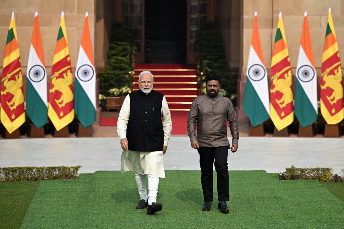 India's Prime Minister Narendra Modi (L) and Sri Lanka's President Anura Kumara Dissanayake walk before their meeting at the Hyderabad House in New Delhi on December 16, 2024. Photo by Sajjad HUSSAIN / AFP.