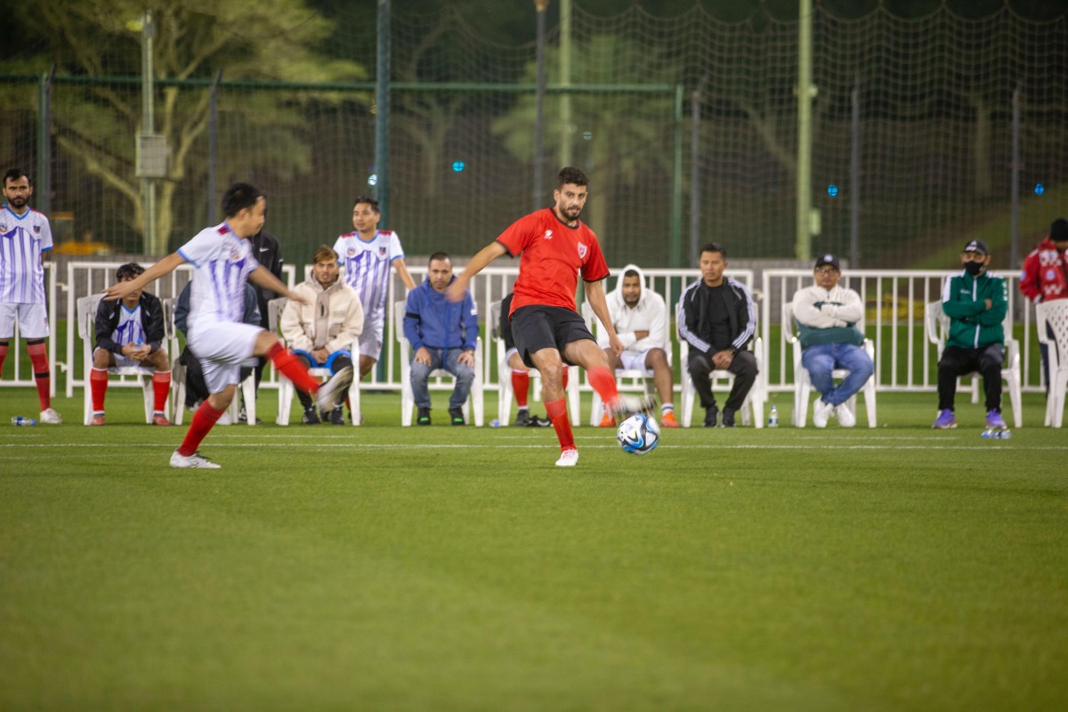 Participants play football at the festival.